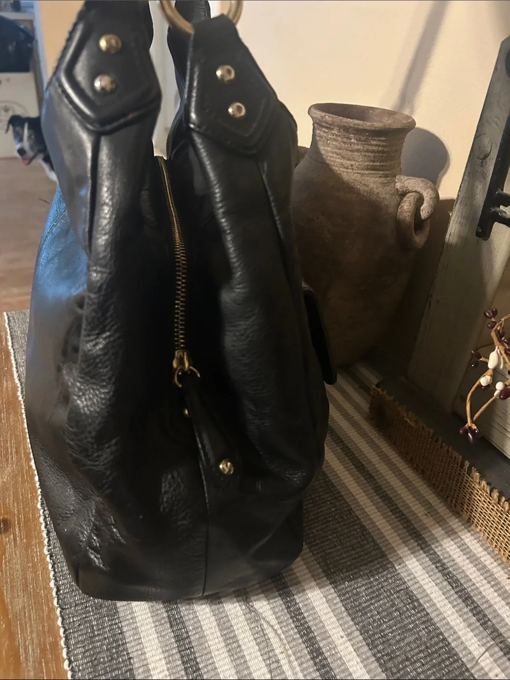Coach Black Leather Shoulder Bag with Front Buckle Pocket and Gold Hardware